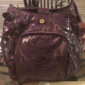 Women’s purple and gold hand bag